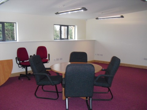 The conference room set with a round meeting table and chairs